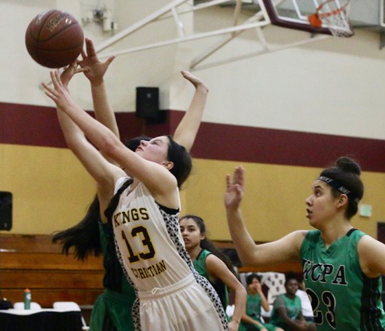 Kings Christian's Rebekah Sills drives past defenders in second half play against Wonderful College Prep Academy on Wednesday.